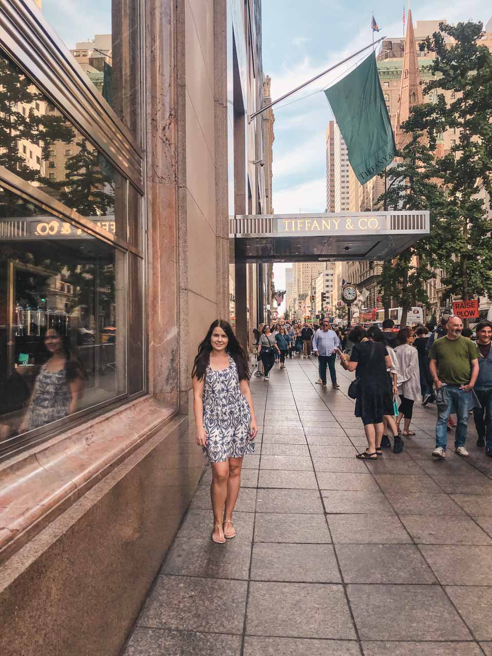 A girl standing outside the Tiffany's flagship in New York City