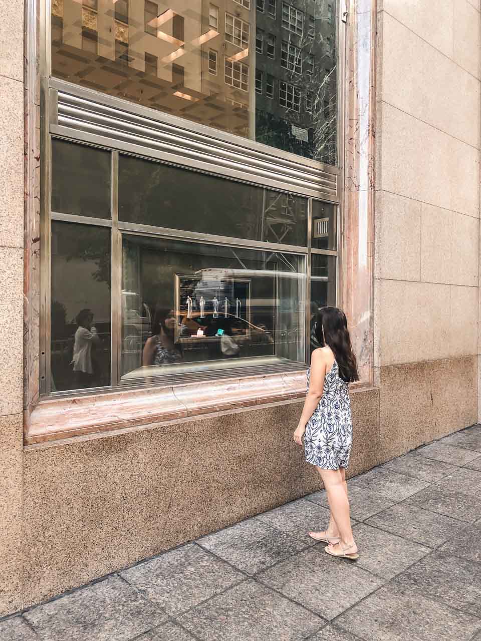 A girl admiring the window display at Tiffany's flagship in New York City