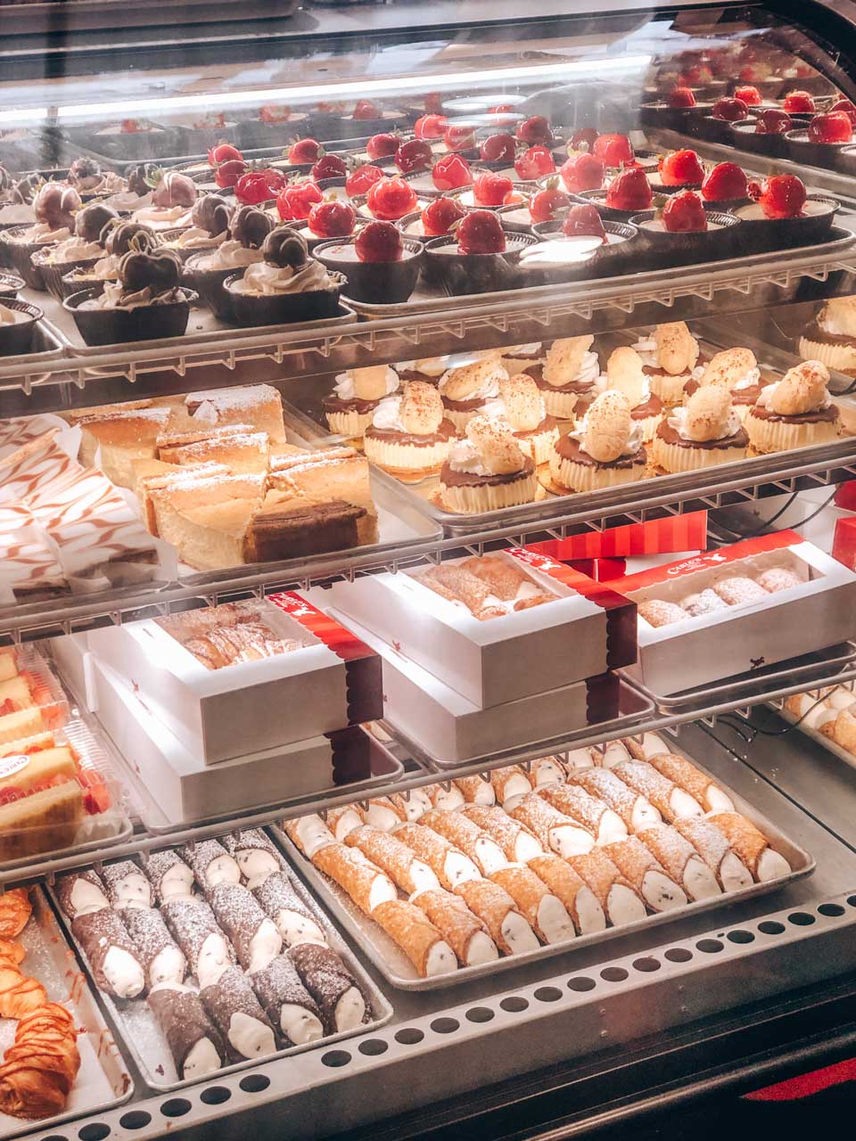 Cupcakes, tartelettes and cannolis on display inside Carlo's Bake Shop in Hoboken, New Jersey