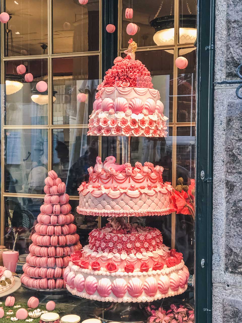 A cake and macaroons on display at La Glace in Copenhagen, Denmark