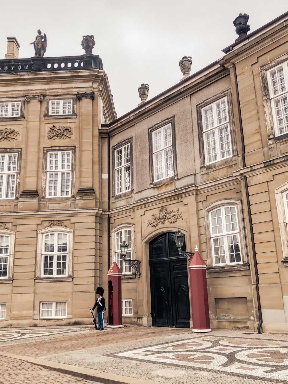 A royal guard standing outside Amalienborg Castle in Copenhagen, Denmark