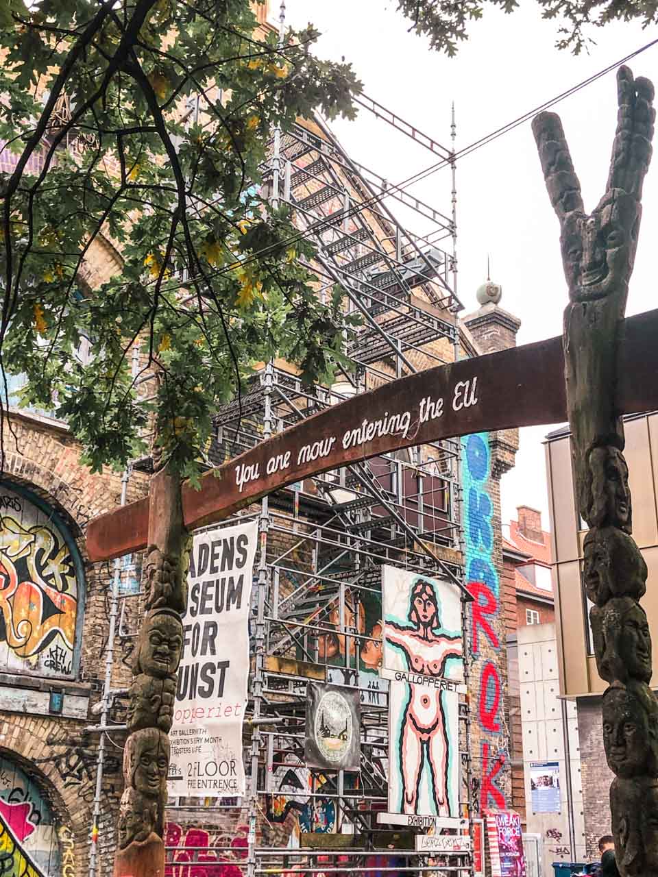 Gate upon leaving the district of Christiania in Copenhagen that says "You are now entering the EU"