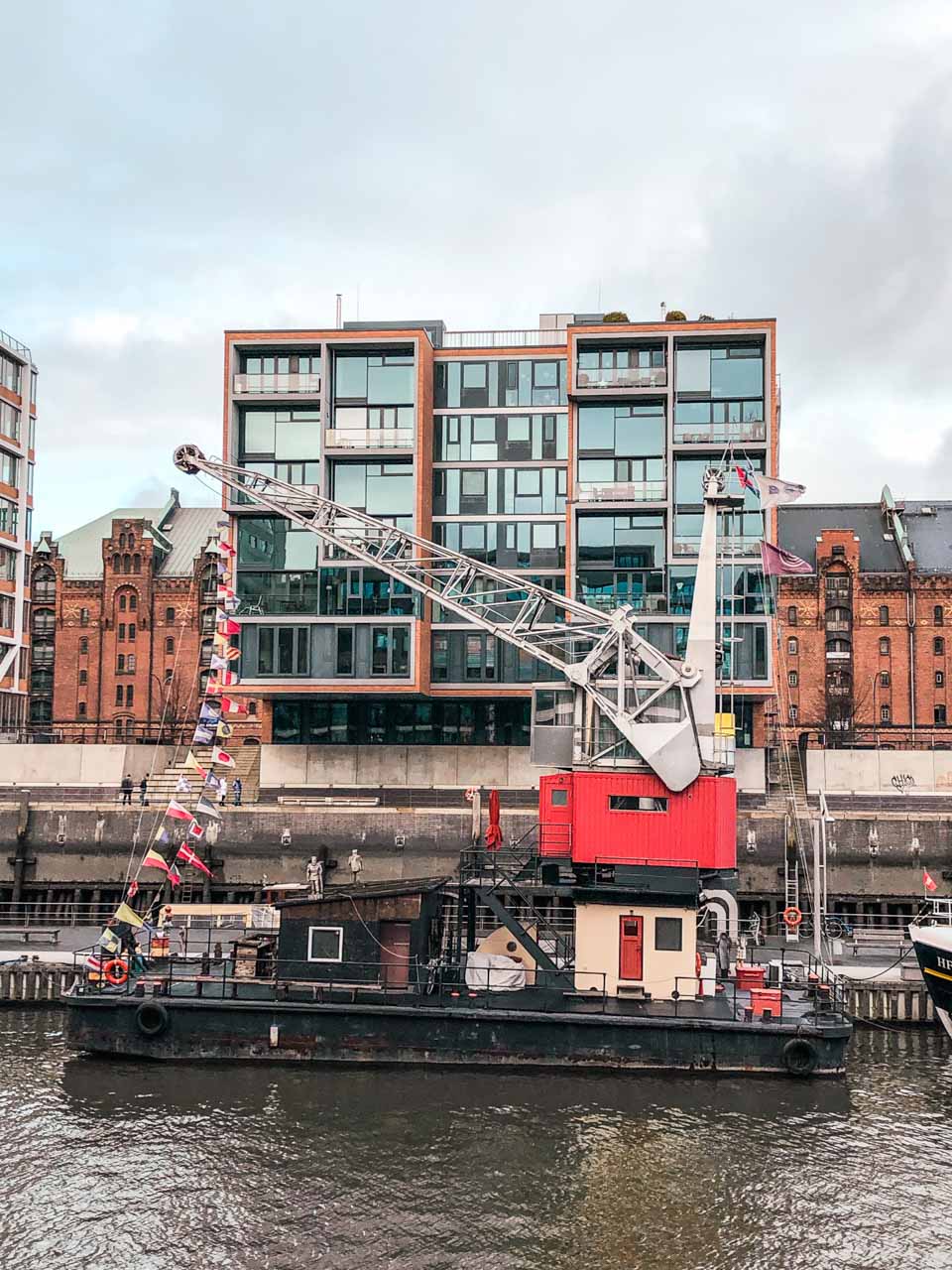 A boat with a crane in the harbour in Hamburg, Germany