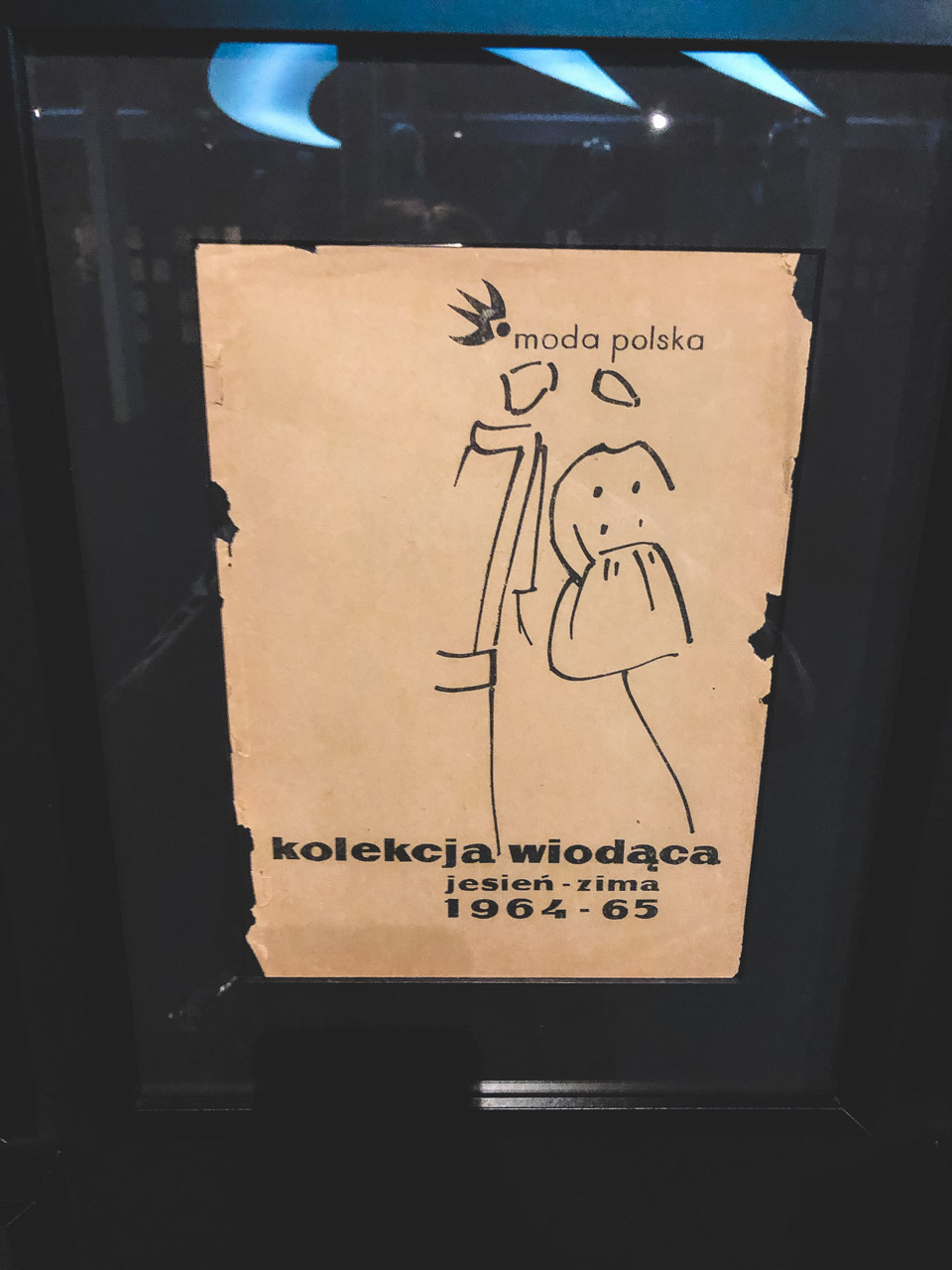 A graphic announcing the Autumn/Winter 1964/65 Moda Polska collection on display at The Central Museum of Textiles in Łódź, Poland