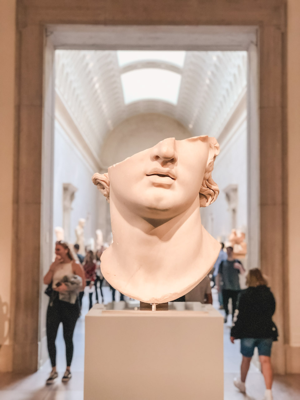 A half-face statue on display at The Met