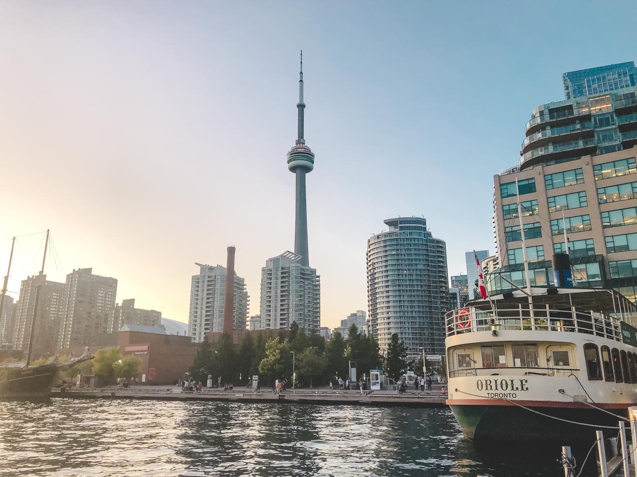 CN Tower and the Toronto skyline at sunset seen from the harbour