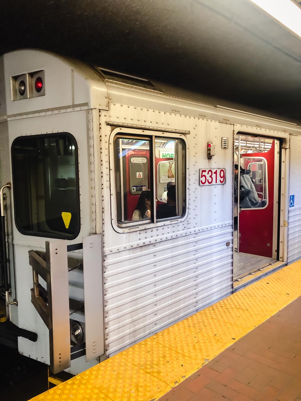 A subway train standing on a platform in Toronto, Canada
