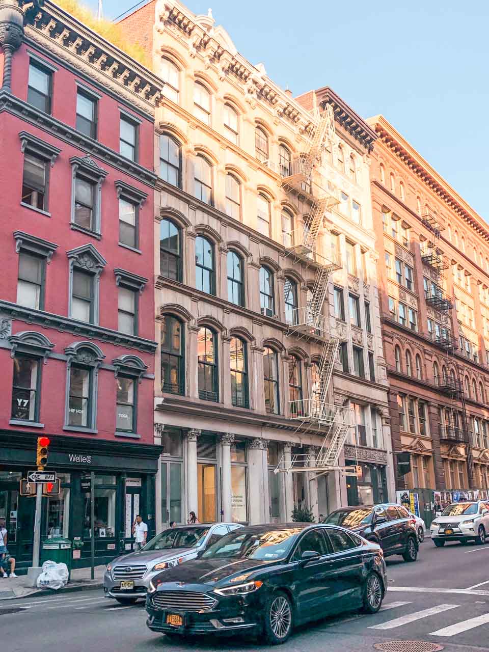 Cars driving down a street in New York