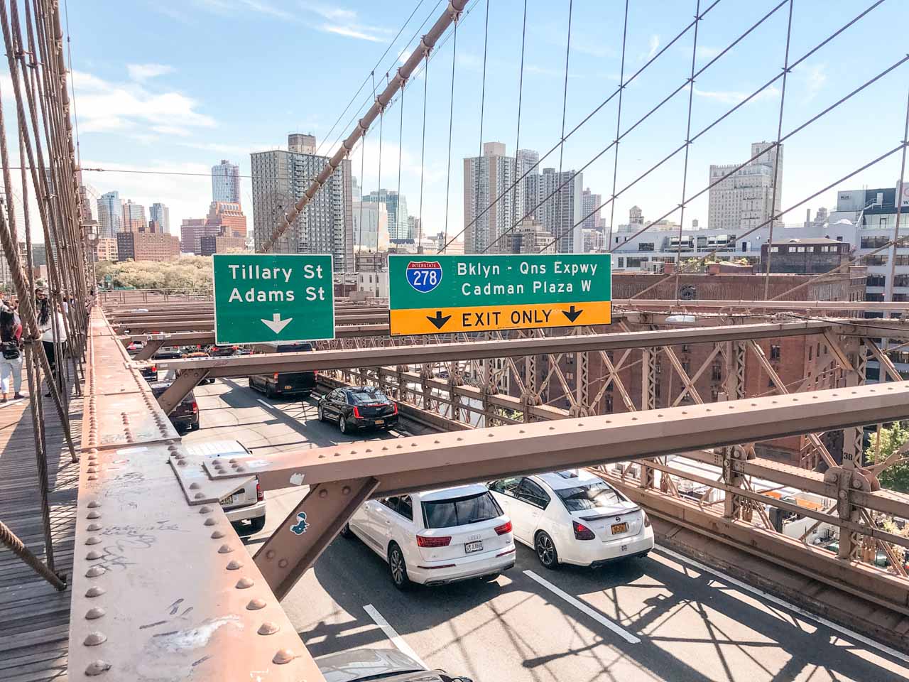 Cars driving across the Brooklyn Bridge