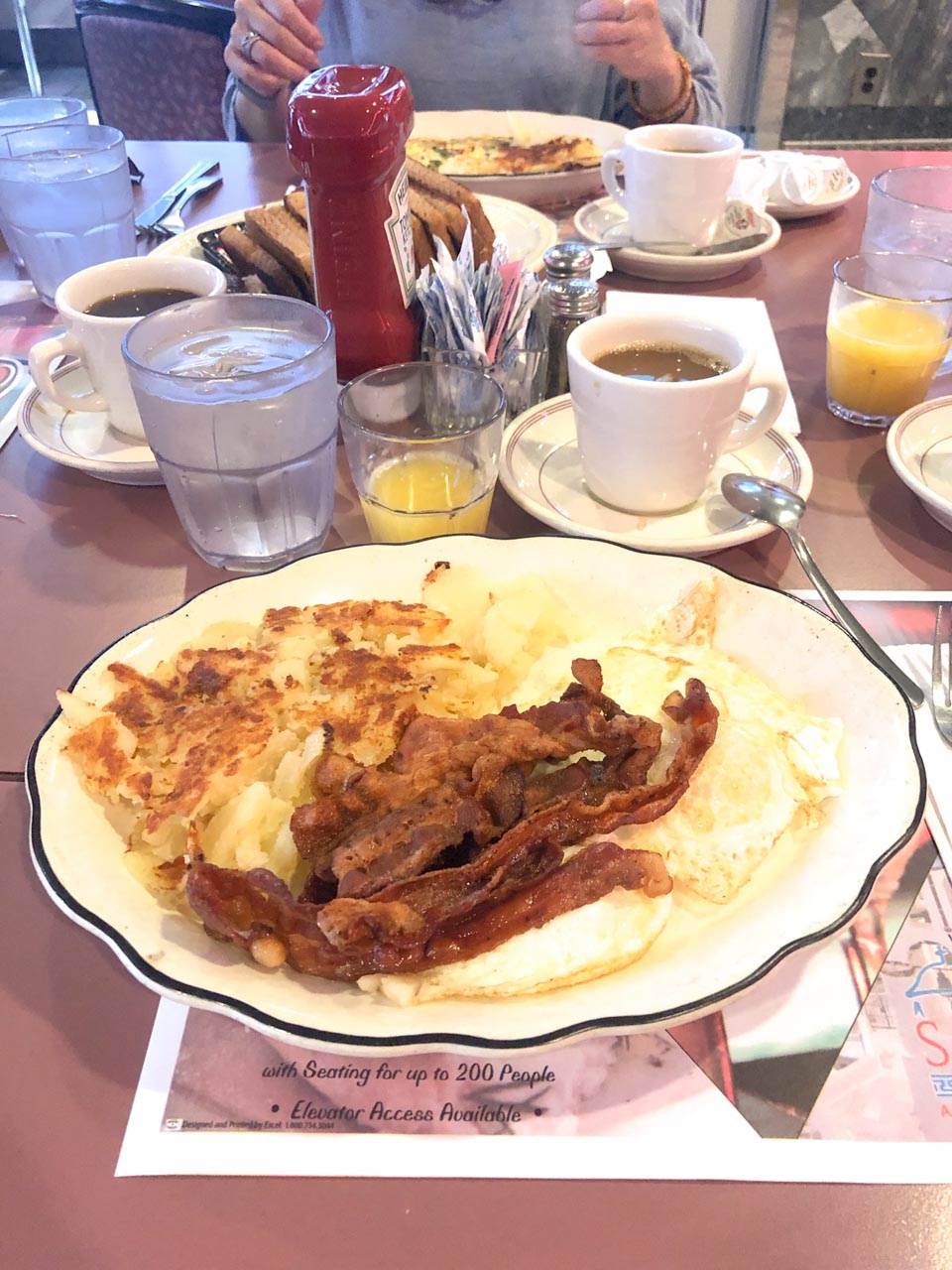 A plate of eggs, bacon and home fries at Colonnade Diner on Staten Island