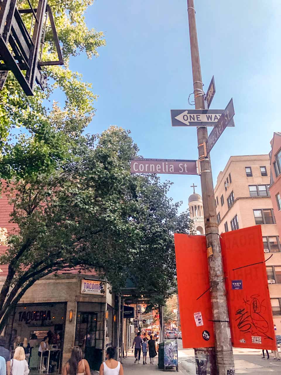 A street sign on the corner of Cornelia Street and Bleecker Street in New York