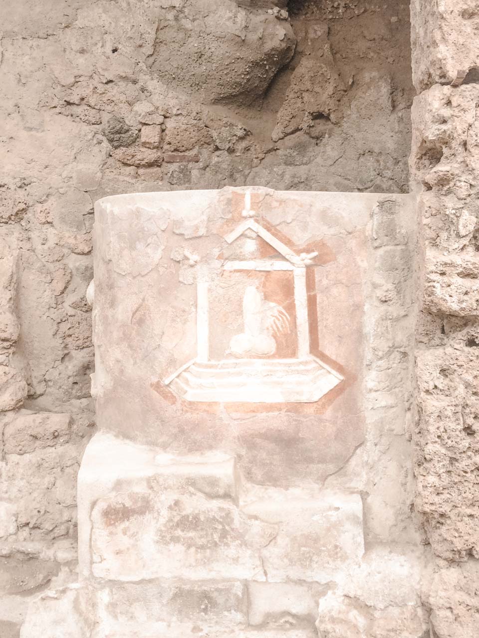 A phallic sculpture marking the entrance to a former brothel inside Pompeii