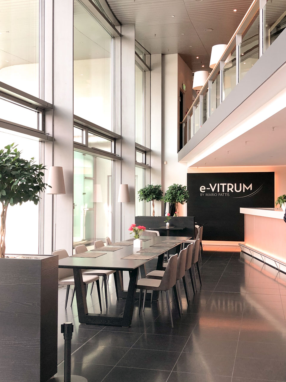 Tables inside the e-Vitrum restaurant at the Transparent Factory in Dresden, Germany
