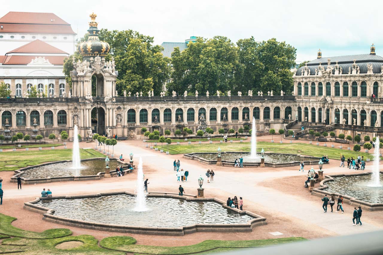 People walking around Zwinger Square in Dresden, Germany seen from above