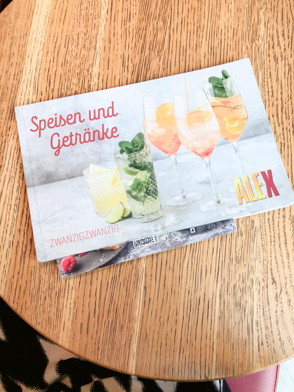 A bird's eye view of a menu placed on a table at Alex in Dresden, Germany