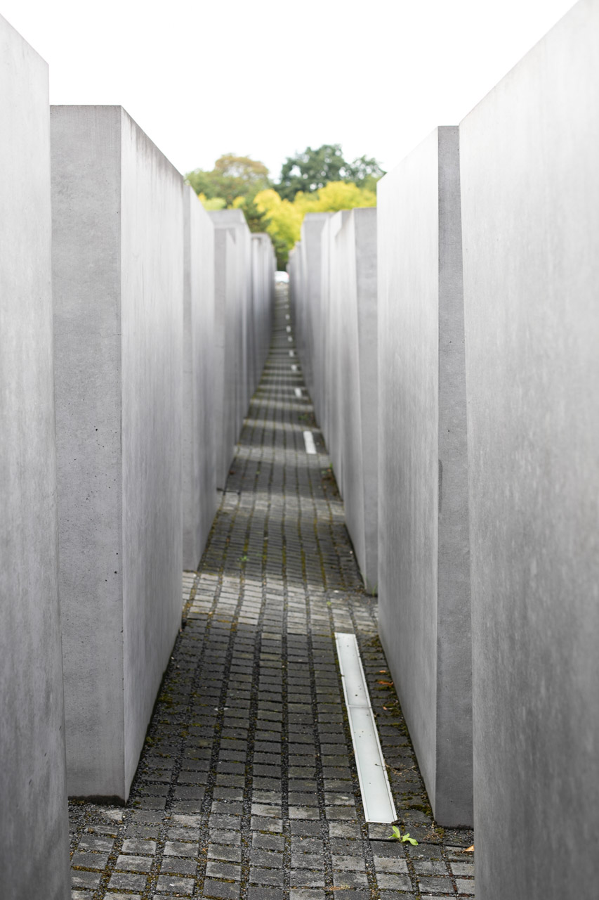 An alley between concrete slabs at the Memorial to the Murdered Jews of Europe in Berlin, Germany