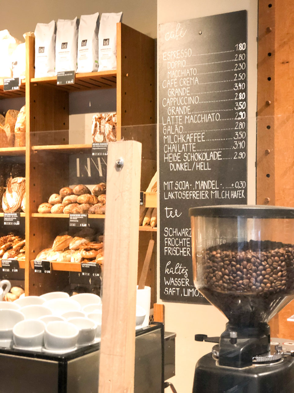 Coffee beans and bread behind the counter at Zeit für Brot in Berlin, Germany