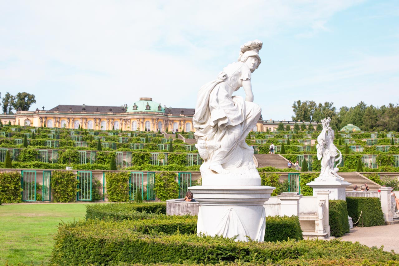 White statue outside Sanssouci Palace in Potsdam, Germany