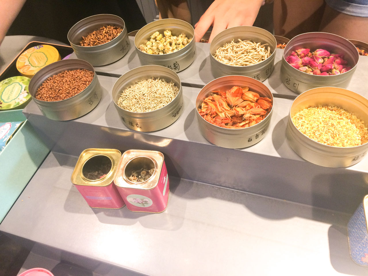 Rows of open tea tins on display at a tea shop in Beijing, China