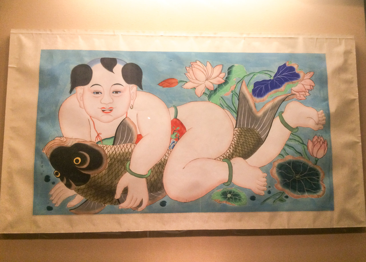 Painting depicting a Japanese man straddling a fish at the Capital Museum in Beijing