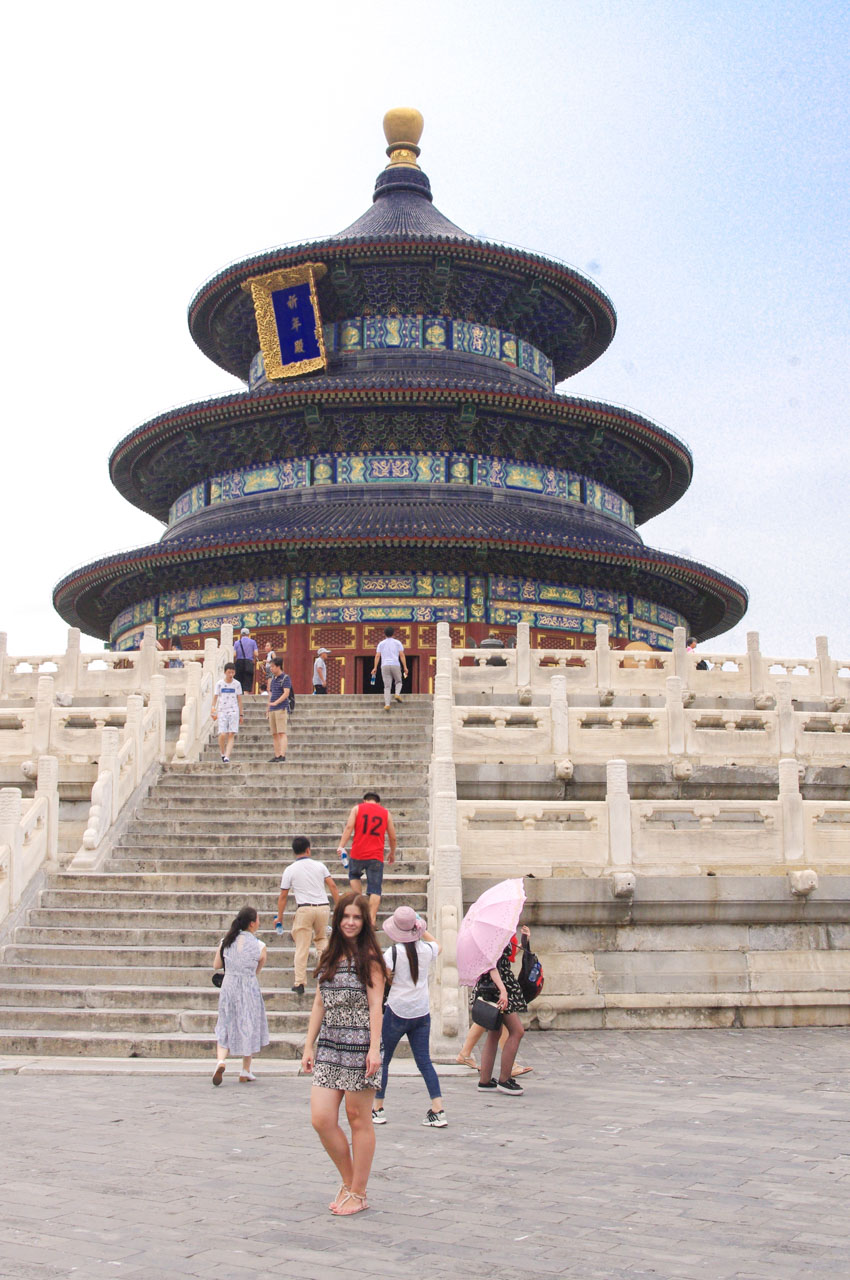 Woman standing in front of the Hall of Prayer for Good Harvests in the Temple of Heaven in Beijing