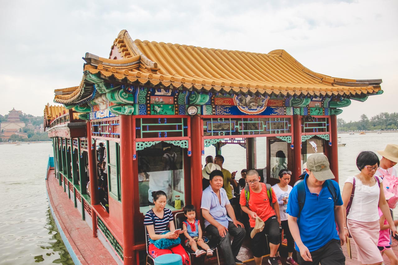 Asian tourists on a large dragon boat on Kunming Lake at the Summer Palace in Beijing, China