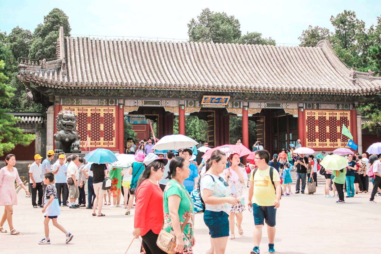 Crowds of tourists walking in front of the entrance gate to the Summer Palace in Beijing, China