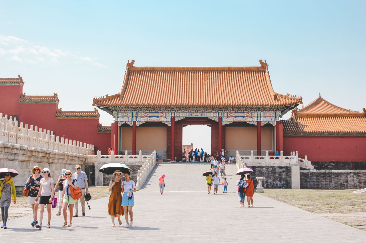 Crowds of tourists walking around the Forbidden City in Beijing, China