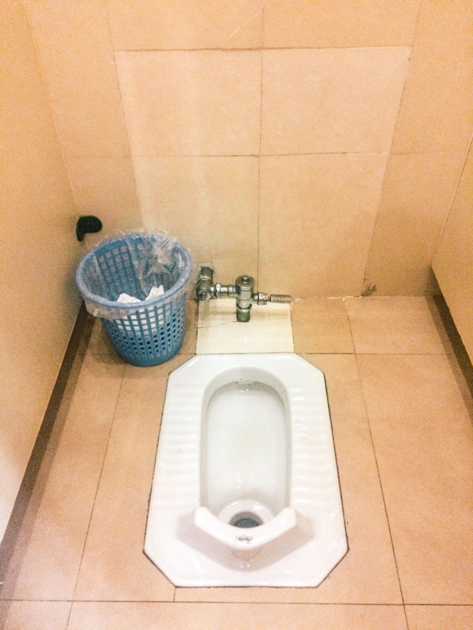 A traditional Asian squat toilet in Beijing, China