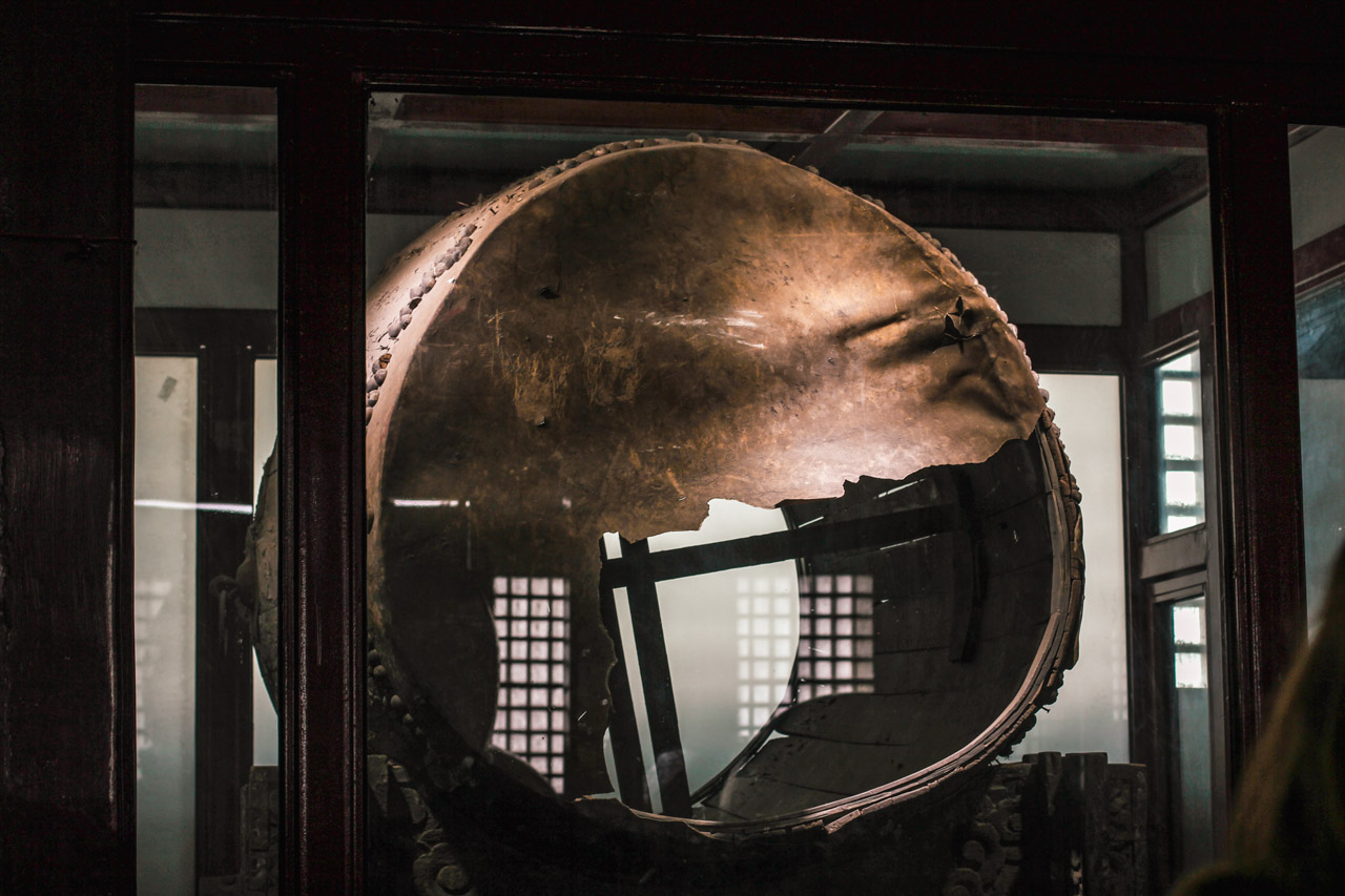 An old torn drum on display at the Bell and Drum Towers in Beijing, China