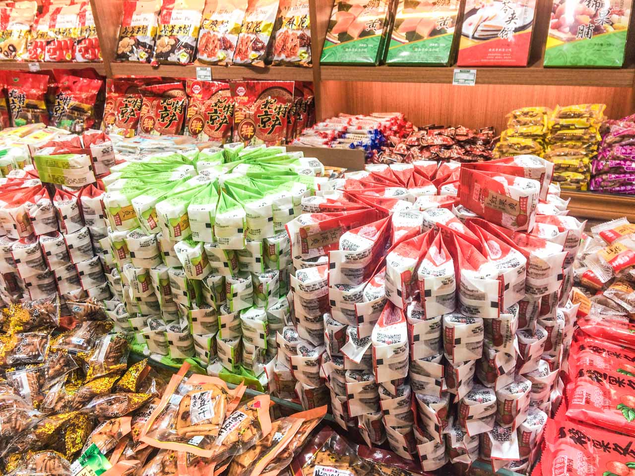 Stacks of Asian snacks arranged to resemble rows of flowers inside a shop in Beijing, China