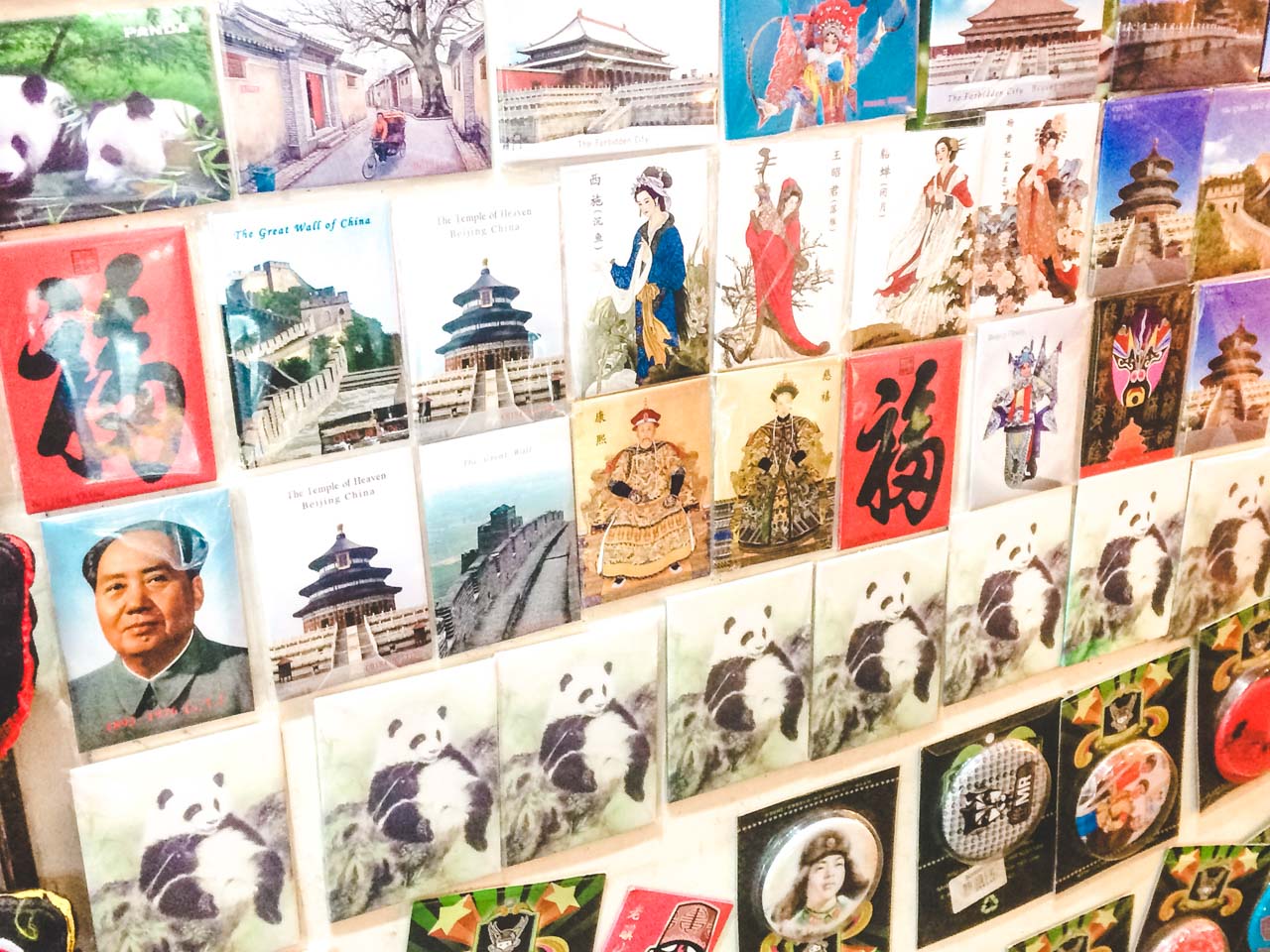 Various magnets featuring Mao Zedong, the giant panda and Beijing landmarks hanging on the wall
