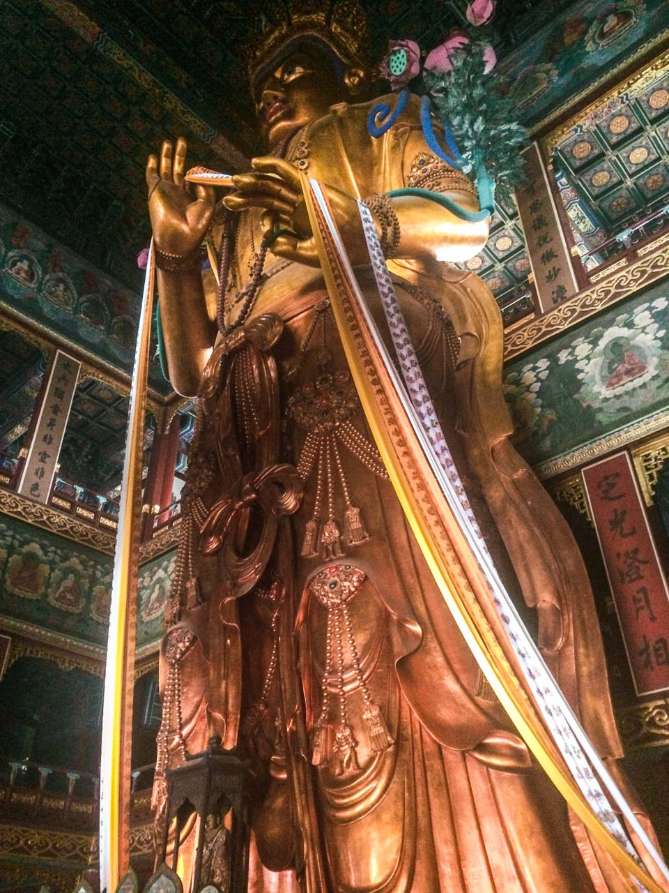 A giant Maitreya Buddha statue at the Yonghegong Lama Temple in Beijing, China