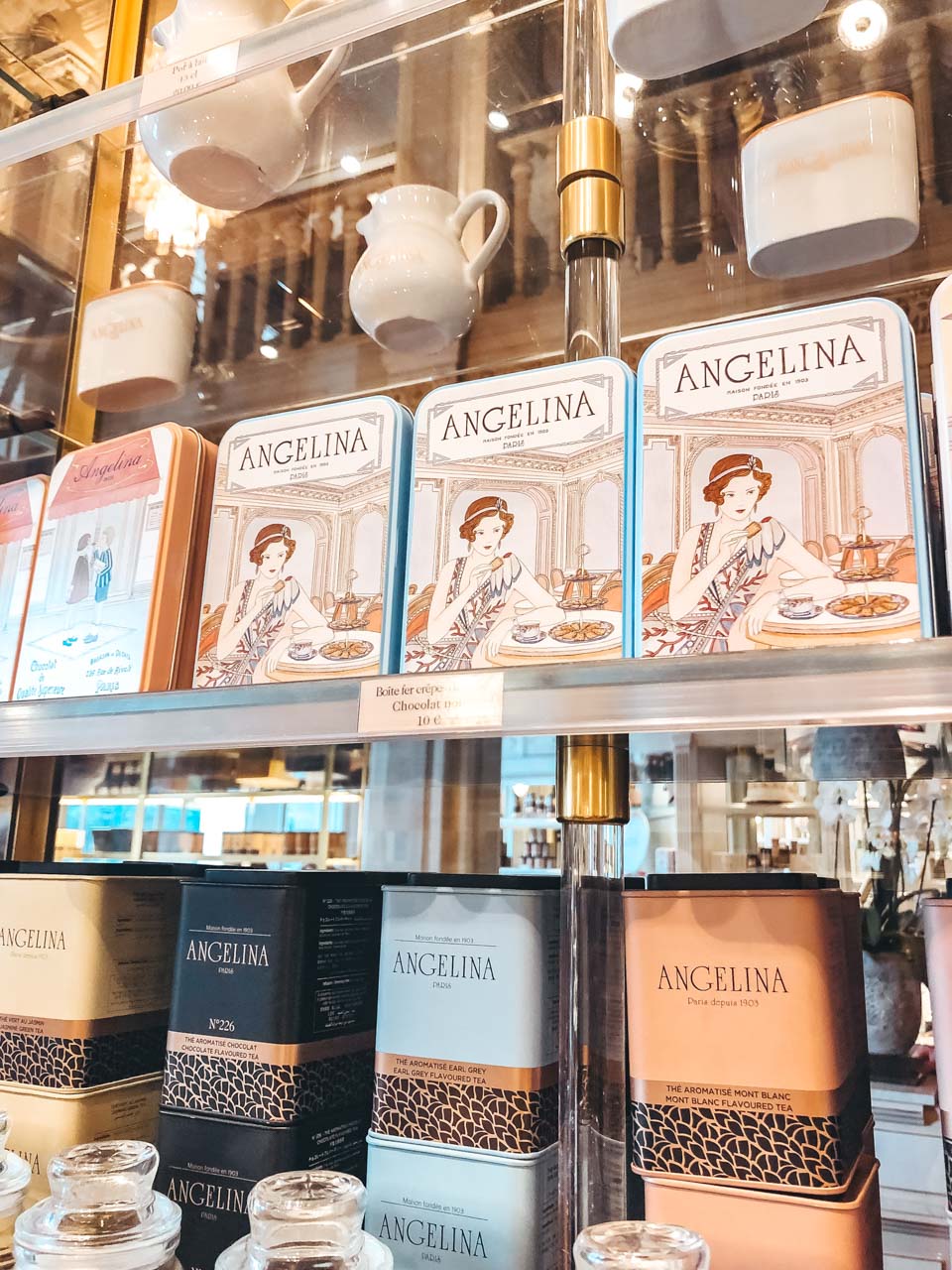 Shelves of the gift shop at the Angelina tea house and café stacked with tins of chocolates and tea