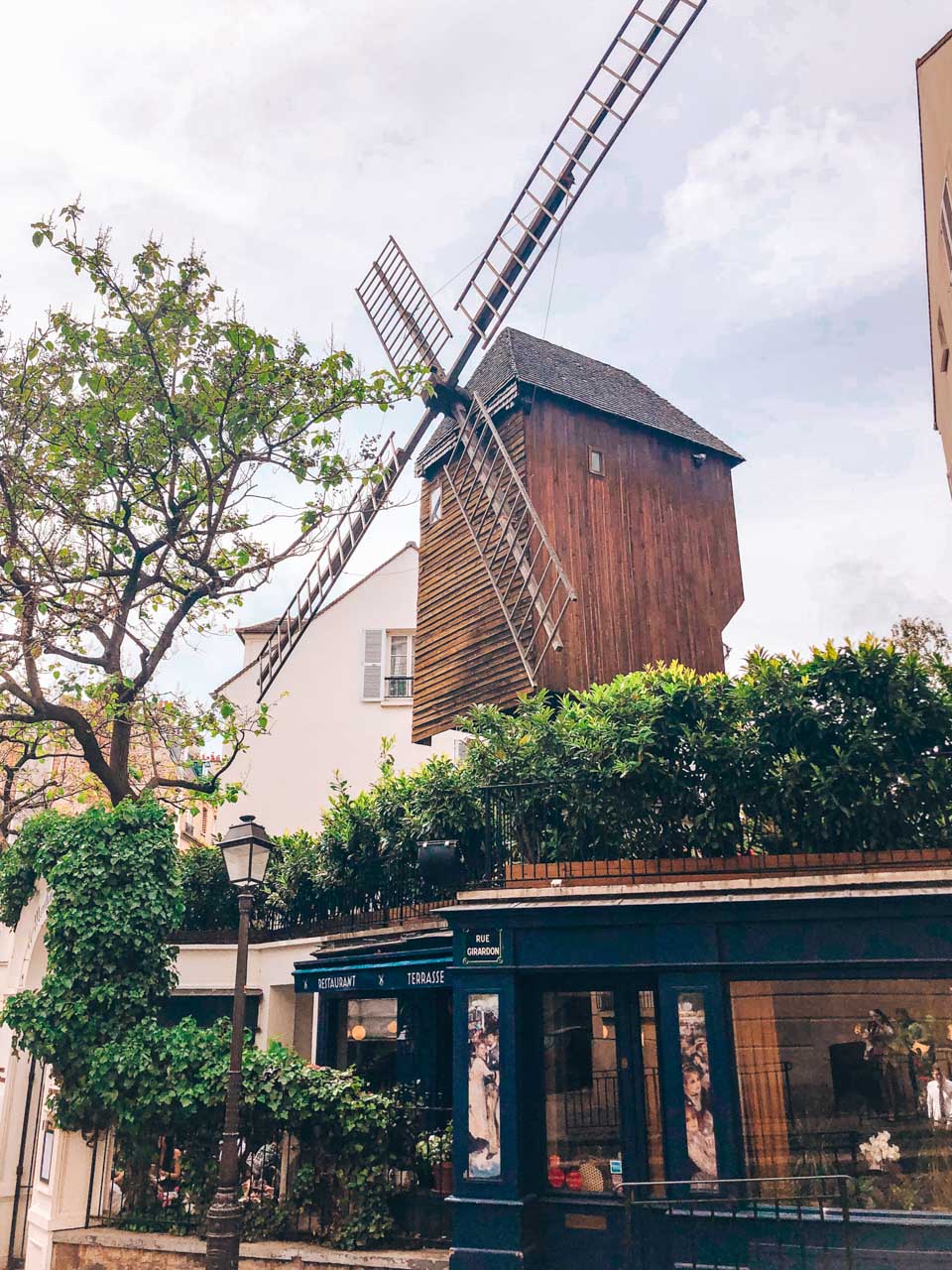 Windmill Moulin Radet atop the historic Le Moulin de la Galette restaurant in Paris