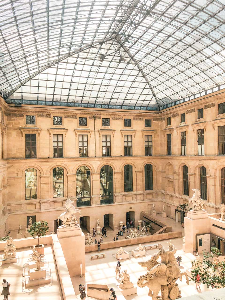 The Cour Marly sculpture courtyard in the Louvre Museum in Paris, France