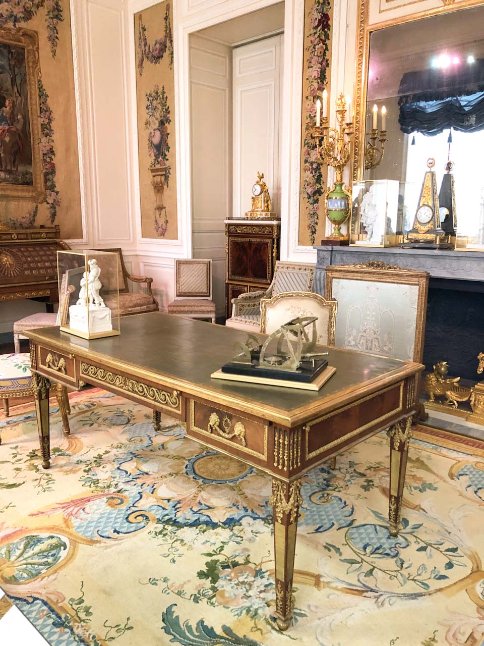 Wooden desk in the "From Louis XIV to Louis XVI" rooms in the Louvre Museum in Paris, France