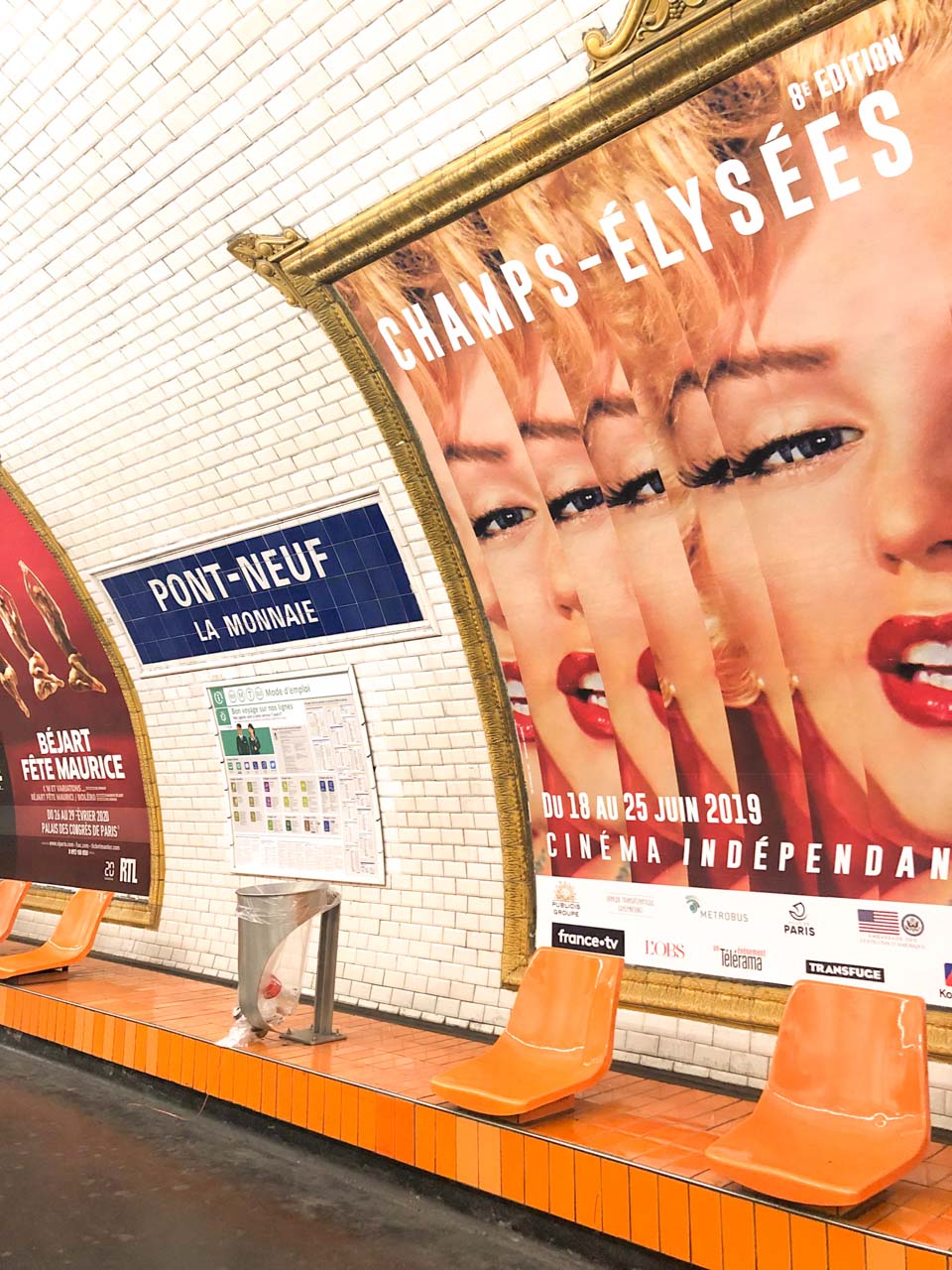 Billboards at the Pont-Neuf La Monnaie metro station in Paris including one featuring Marilyn Monroe