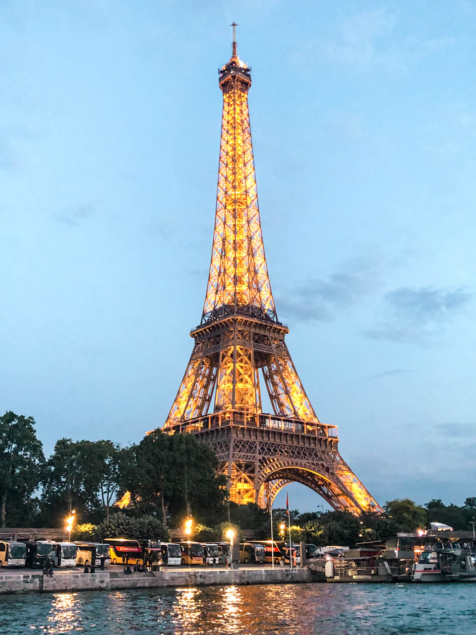 Sparkling Eiffel Tower in the evening seen from a Seine River cruise boat