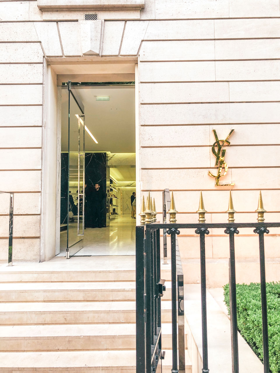 The Yves Saint Laurent logo by the entrance to the flagship store on Avenue Montaigne in Paris