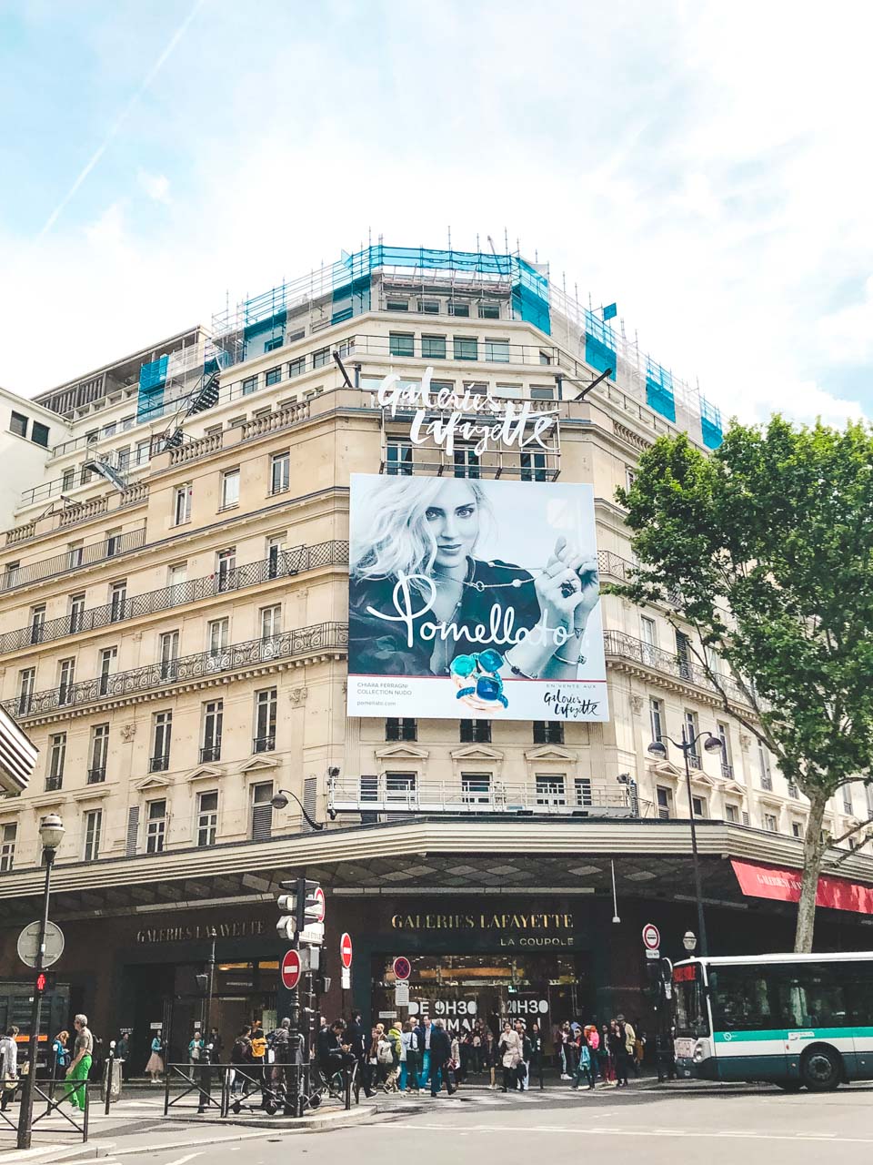 A billboard featuring Chiara Ferragni above the entrance to Galeries Lafayette Hausmann in Paris