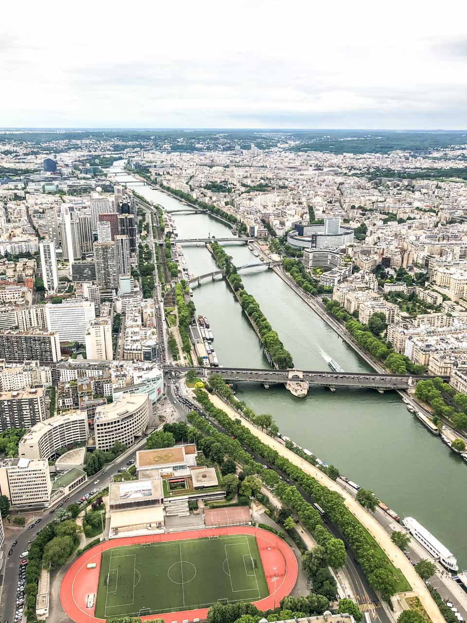 An aerial view of various bridges on the Seine River seen from the top of the Eiffel Tower