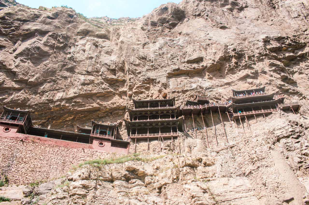 The Hanging Temple in Datong, Shanxi built into the side of a cliff seen from the ground