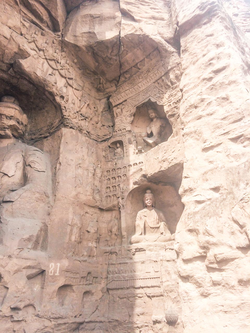 Statues carved into the cliffside at the Yungang Grottoes in Datong, Shanxi