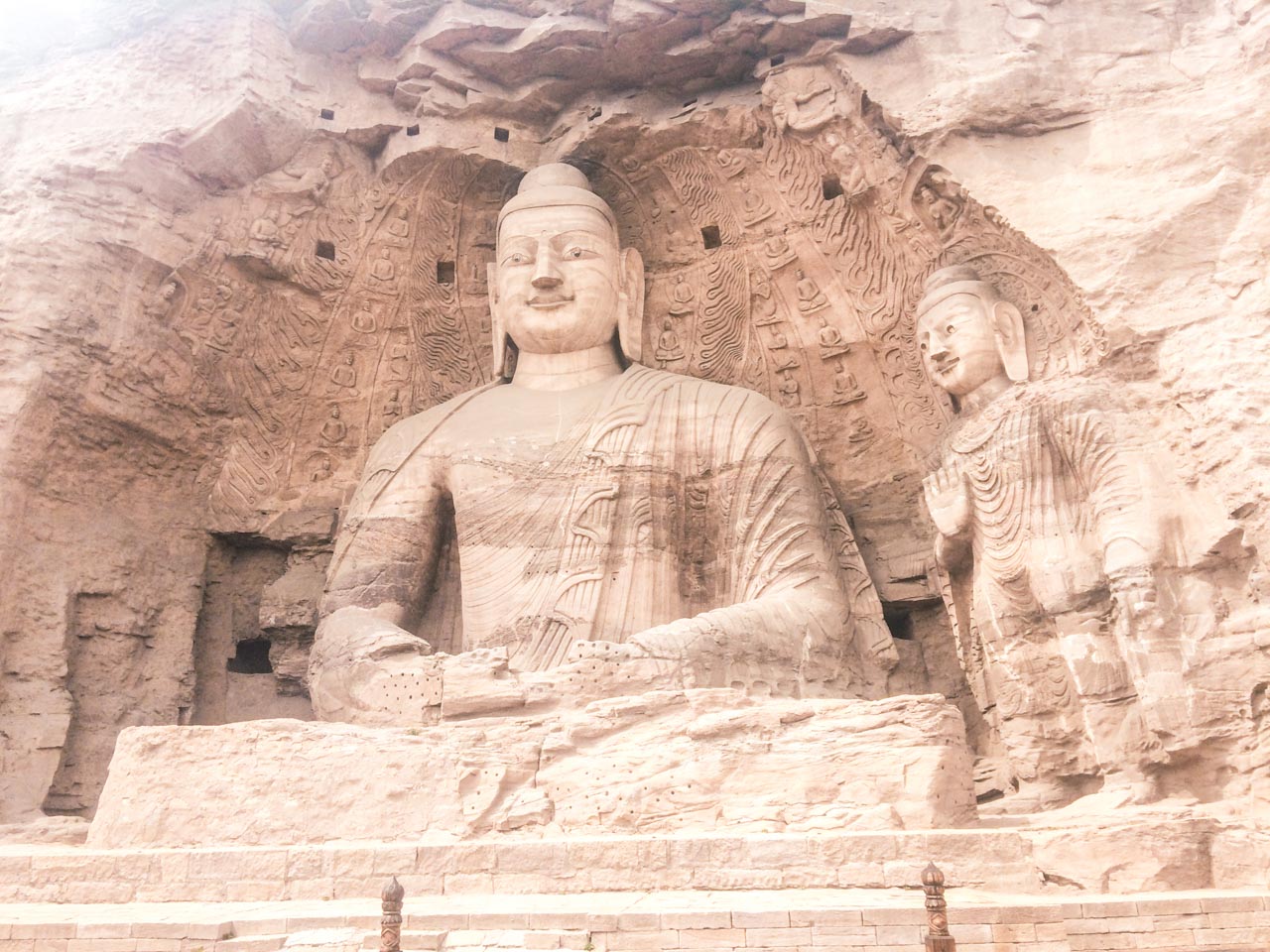 Buddha statues carved into the cliffside at the Yungang Grottoes in Datong, Shanxi