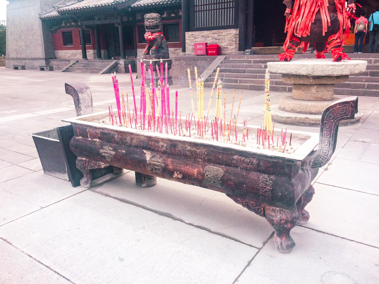 Burning incense (joss) sticks outside the Lingyan Temple near the Yungang Grottoes in Datong, Shanxi