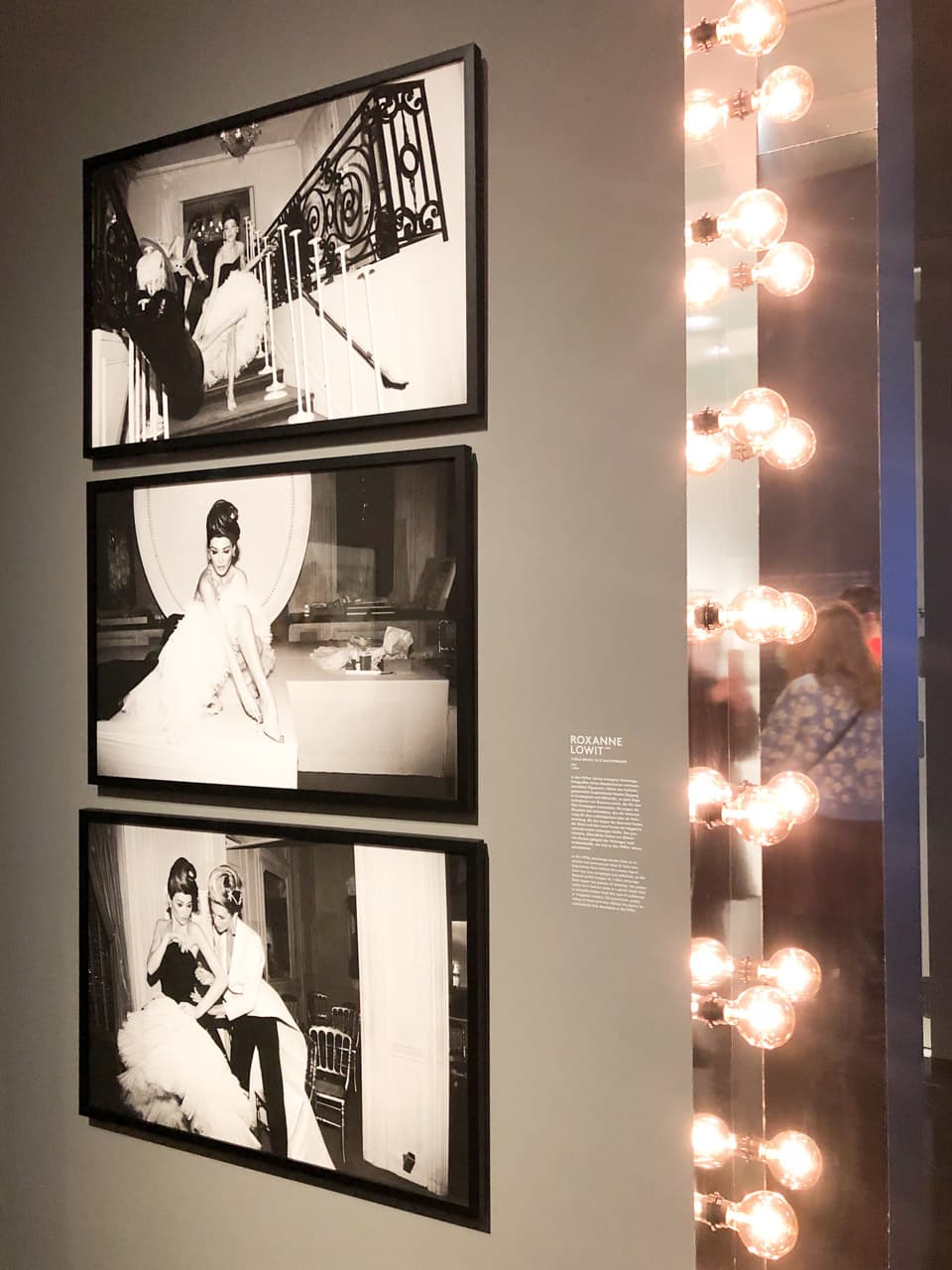 Three framed black and white photos of supermodels taken backstage of a fashion show by Roxanne Lowit