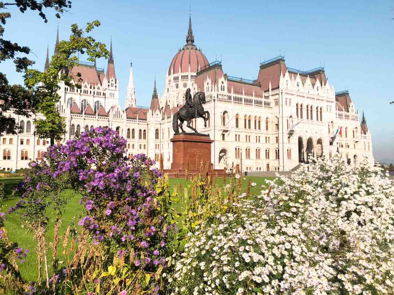 Statue of Ferenc Rakoczi II riding a rearing horse in front of the Hungarian Parliament building