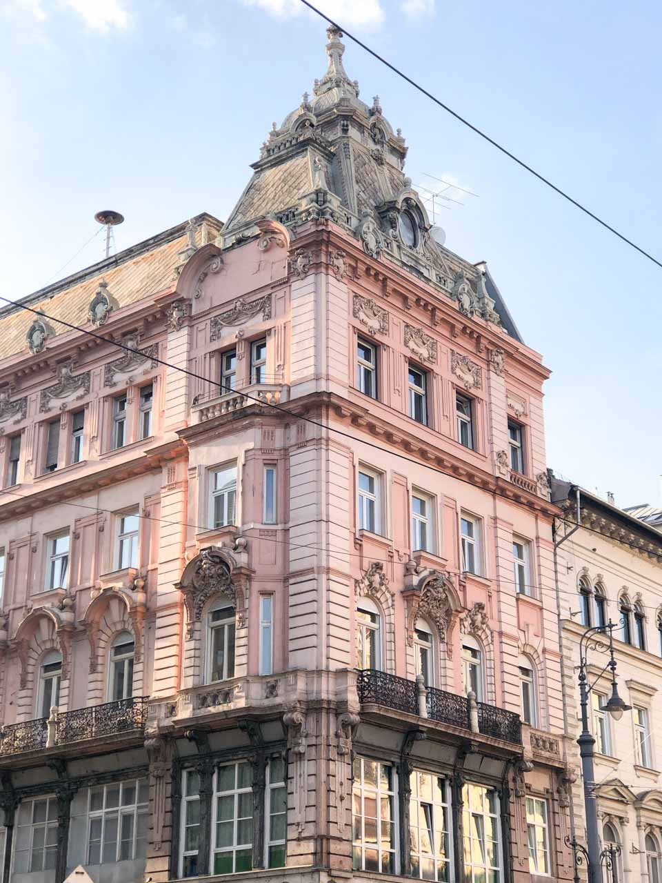 A pastel pink building in Budapest, Hungary