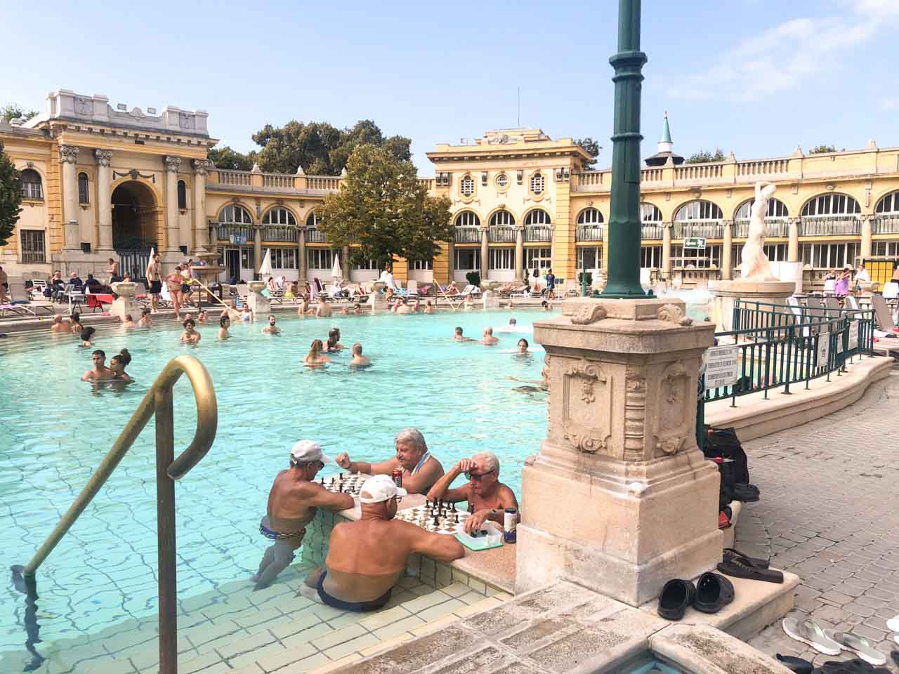 A group of men playing chess at the Széchenyi Thermal Bath in Budapest, Hungary